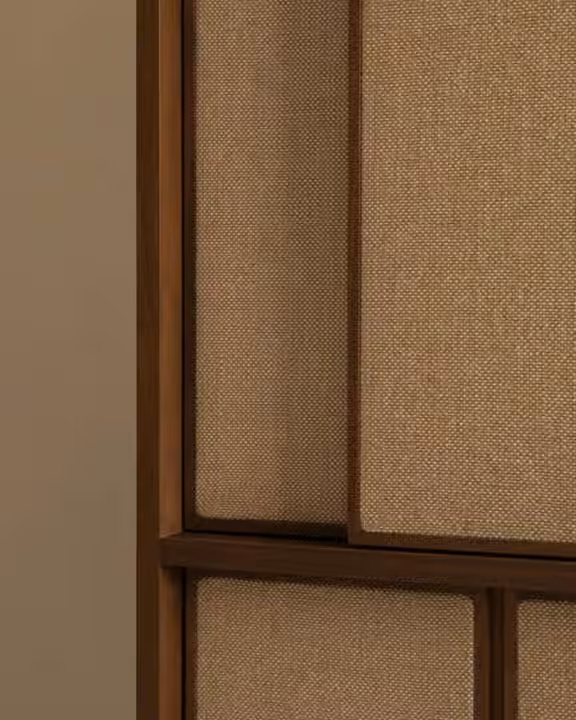 Oak wardrobe doors with woven cane panels and carved wooden handles.